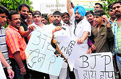Youth Congress workers protest against fuel price hike at the Congress Bhawan in Sector 35, Chandigarh, on Tuesday