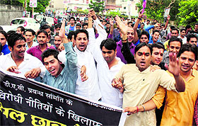 Students of DAV College protest outside the District Magistrates office in Dehradun on Tuesday.