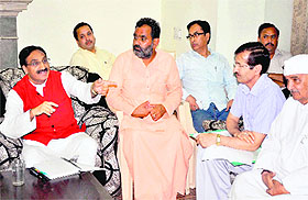 MP Dr Ramesh Pokhriyal Nishank directs government officials at Damkoti state guest house in Haridwar on Tuesday.