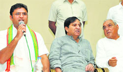 (From left) State Congress chief Ashok Tanwar, party in-charge Shakeel Ahmed and Chief Minister Bhupinder Singh Hooda at the press meet in Chandigarh on Tuesday. Tribune Photo: Manoj Mahajan