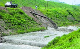 A truck loaded with silt being dumped in to the Suketi Khud in Sundernagar on Tuesday.