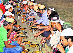 Muslims break their fast on the second day of the holy fasting month of Ramadan
