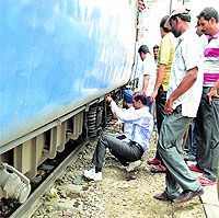 echnical staff of the Railways examine the coach before the departure at the Ludhiana railway station on Tuesday