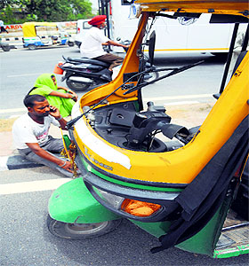 the pickup truck and the damaged windshield of the auto-rickshaw on Ferozepur Road in Ludhiana on Tuesday