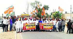 Activists of the Youth Congress block the Ludhiana-Ferozepur highway in Jagraon on Tuesday.