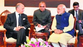 Prime Minister Narendra Modi with French Foreign Minister Laurent Fabius in New Delhi on Tuesday.