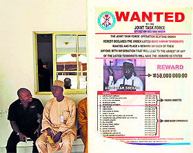 A poster advertising the search of Boko Haram leader Abubakar Shekau is pasted on a wall in Baga village on the outskirts of Maiduguri, Nigeria.