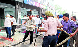 Firemen try to douse the fire that engulfed the garment shops in Amritsar on Wednesday