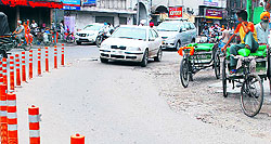 Rickshaw pullers have parked their vehicles on the roadside in Amritsar