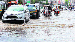 Vehicles make their way through an inundated road in Bathinda on Wednesday
