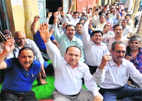 Roadways employees protest at the union office in Dehradun on Wednesday