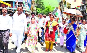 Renuka Rawat, wife of Chief Minister Harish Rawat, leads the procession of party workers to file the nomination papers of Harish Rawat from Dharchula on Wednesday