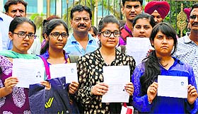 Students and parents protest at Baba Jaswant Singh Dental College in Ludhiana on Wednesday.