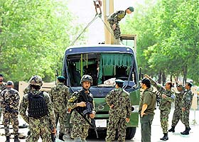 probing blast: Officials investigate at the site of a suicide attack in Kabul on Wednesday.
