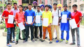 Students of Government Sports School, Ghudda, outside the District Administrative Complex in Bathinda on Thursday.