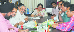MP Kirron Kher with traders at the BJP office in Sector 33, Chandigarh, on Thursday.