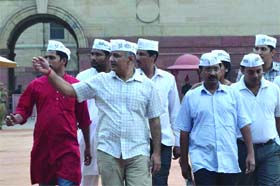 AAP chief Arvind Kejriwal with his party members outside Rashtrapati Bhawan in New Delhi on Thursday