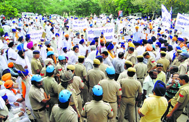SGPC Members protest the formation of a separate gurdwara panel in Kaithal on Thursday. 