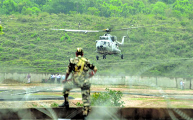 Security men conduct a drill at the railway station on the eve of the PMs visit to Katra, on Thursday. 