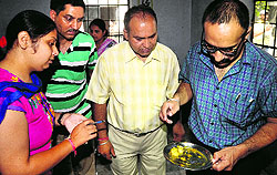 Health teams checking the bug-insfested mid-day at Government Primary School Garha in Jalandhar on Thursday