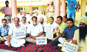 The councillors protest at the Zone A office of the civic body in Ludhiana.