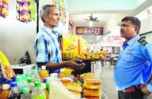 A vendor argues with a security guard at the bus terminal in Ludhiana.