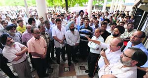 Bank employees hold a protest outside the PNB at Sector 17, Chandigarh, on Friday