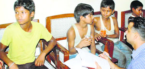 An official records the statements of rescued child labourers in Ambala on Friday.