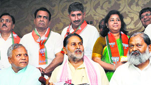Haryana BJP president Ram Bilas Sharma (centre) flanked by Ambala MP Rattan Lal Kataria (left) and MLA Anil Vij at a press conference in Chandigarh on Friday.