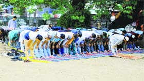 Muslims offer prayers during Ramadan in a park in Srinagar on Friday.