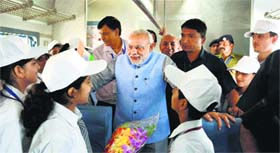 Prime Minister Narendra Modi interacts with children on board the inaugural train on the Katra-Udhampur rail link on Friday.