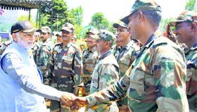 Prime Minister Narendra Modi interacts with soldiers at the Badami Bagh Cantonment in Srinagar on Friday.