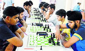 Players compete in a chess tournament in Ludhiana on Friday.