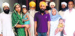 Lakhwinder (in purple T-shirt) with his family at Mandi Gobindgarh