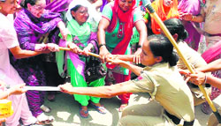Anganwadi workers clash with the police in Sangrur on Friday. A Tribune photograph