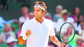 Switzerlands Roger Federer reacts after winning a game against Canadas Milos Raonic during the semifinal.