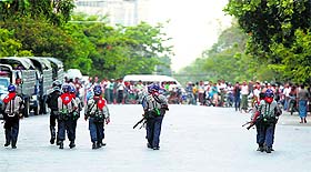 Spiked Tensions: Policemen patrol in a Muslim neighbourhood in Mandalay, Myanmar, on Friday.