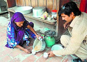 Pakistani Hindu residents displaced by a military operation in the North Waziristan tribal agency are putting up at a temporary shelter at a school in Bannu.