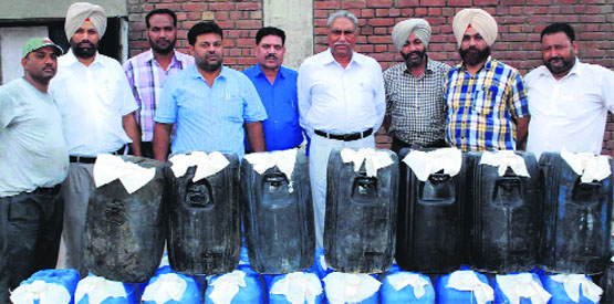 The CIA staff shows liquor seized in Amritsar. A tribune photo