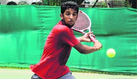A player returns a shot during a match at the CLTA grounds in Chandigarh on Saturday.