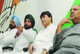 DPCC president Arvinder Singh Lovely along with party leaders Haroon Yusuf (C), Mukesh Sharma (R) and AIICC secretary Kuldeep Singh Nagra (L) addresses a press conference in New Delhi on Saturday