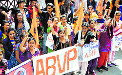 Activists of the ABVP raise slogans against fee hike and RUSA outside the DC office in Shimla on Saturday