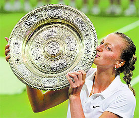 Petra Kvitova of the Czech Republic kisses the winners trophy, the Venus Rosewater Dish, after defeating Eugenie Bouchard of Canada in the final of Wimbledon in London on Saturday.