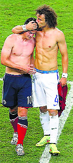Brazils David Luiz (R) consoles Colombias James Rodriguez after the match.