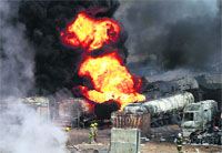 Smoke and flames rise from fuel trucks after an overnight attack by the Taliban on the outskirts of Kabul on Saturday. Reuters