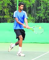 A player in action during the CLTA-AITA Mens and Womens Tennis Tournament at the CLTA, Chandigarh, on Sunday. 