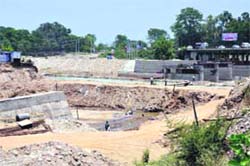 BONE OF CONTENTION: Expansion cum construction work being carried out by the Uttar Pradesh Irrigation Department at the Mayapur Scrap Iyrish Bridge, Shankaracharya stretch, in Haridwar on Saturday