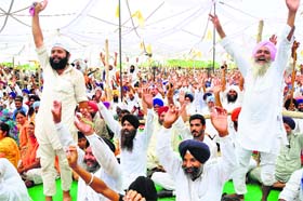 Sikhs rejoice at the formation of the Haryana Sikh Gurdwara Parbandhak Committee during a Sikh Sammelan at Patti Afghan village in Kaithal district on Sunday