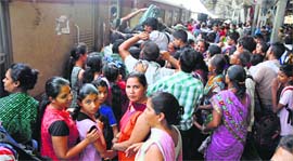 Passengers at the Jammu railway station jostle to board the train to Katra on Sunday.