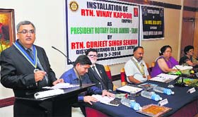 Vinay Kapoor, newly elected president of Rotary Club, Jammu Tawi, addresses a function in Jammu on Sunday.